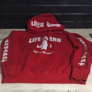 Unisex red Lifeguard Ft Myers Beach hoodie with pocket pouch in front size Large
